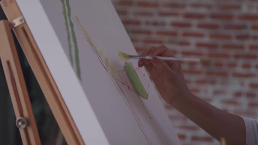 A person is painting a picture indoors