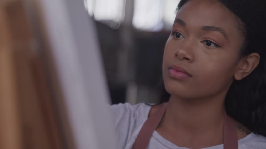 A teenager painting a picture