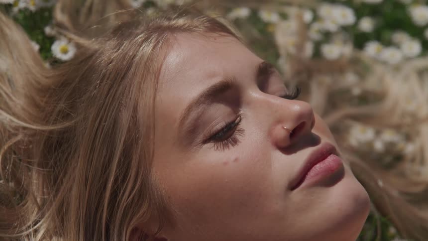 A woman is relaxing outdoors in spring