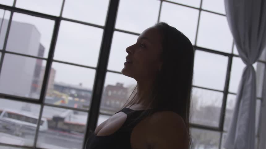 A teenage girl dancing indoors
