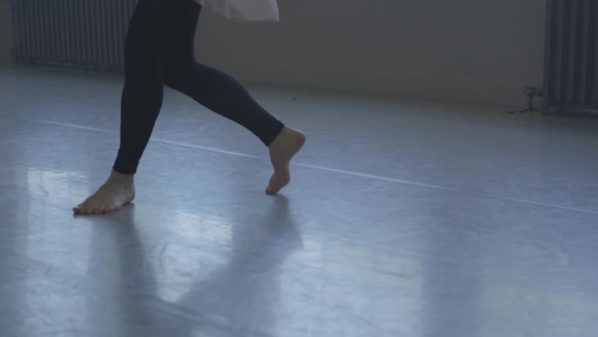 A woman dancing indoors