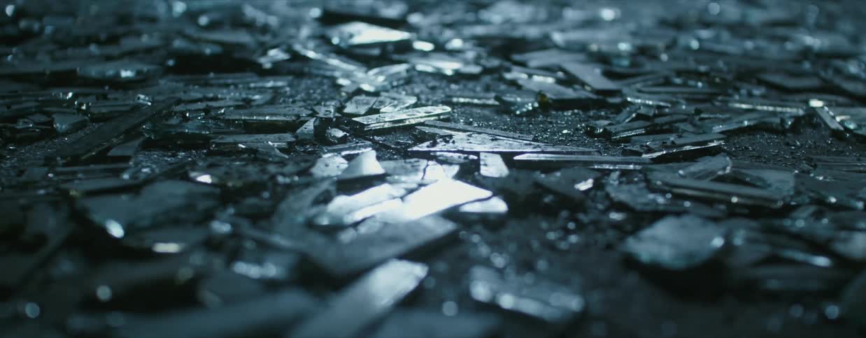 Shards of broken glass on ground