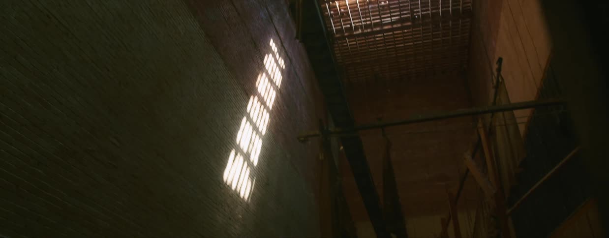 The interior of a building with graffiti on the floor