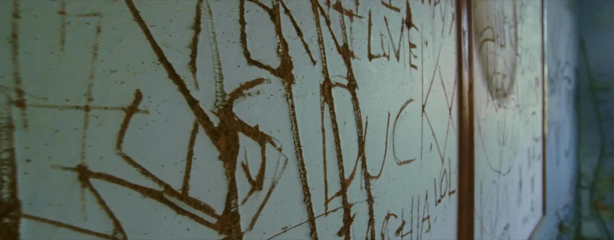 A view of writing and graffiti on a wall