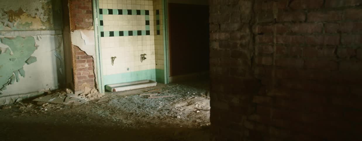 An abandoned room with debris and walls