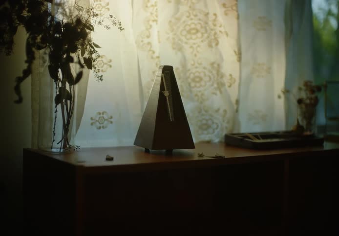 Metronome ticking over a desk in the living room of a house