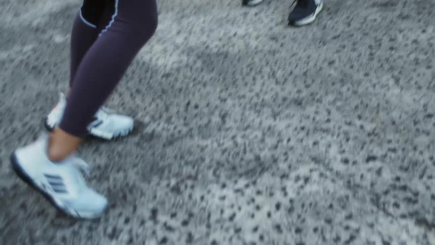 Two teenage girls boxing outdoors on a rooftop