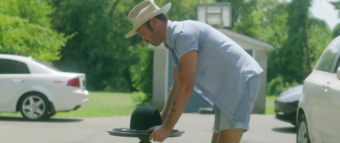 Hat maker places a hat over a table and leaves it to dry under the sun