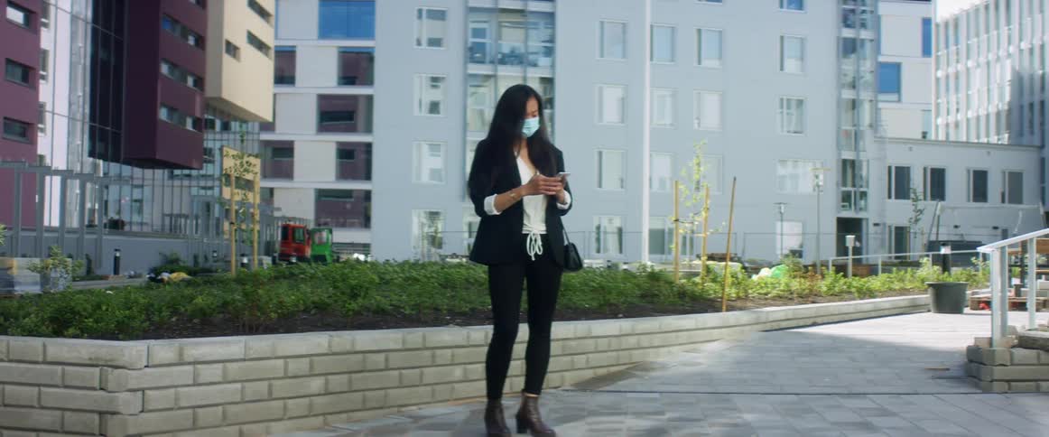 A woman takes out her cell phone to talk