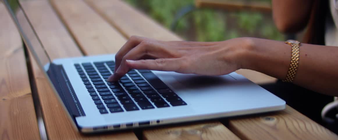 A person is typing on a laptop