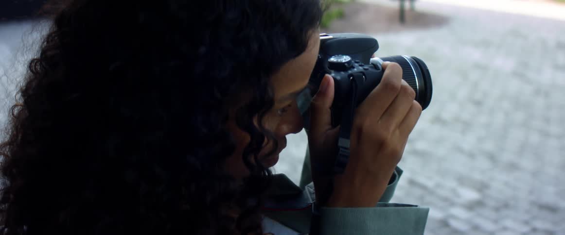 A woman is taking photographs outsiders