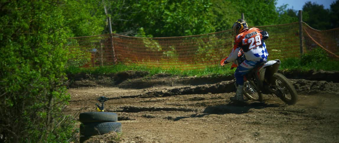 A person riding a motocross bike outside