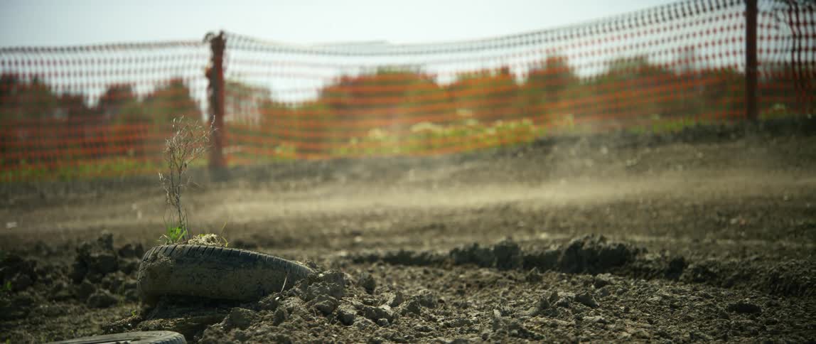 A person doing motocross makes a tight turn