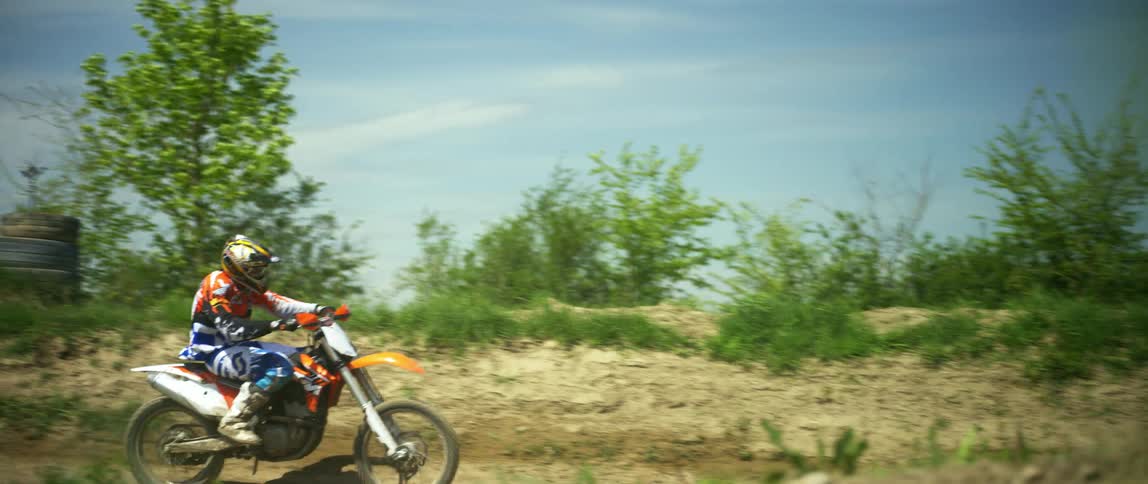 Man riding dirt bike on motocross track
