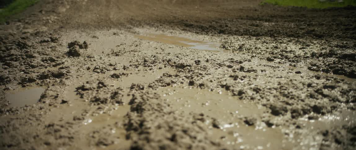 The sun is reflecting off the mud on the track
