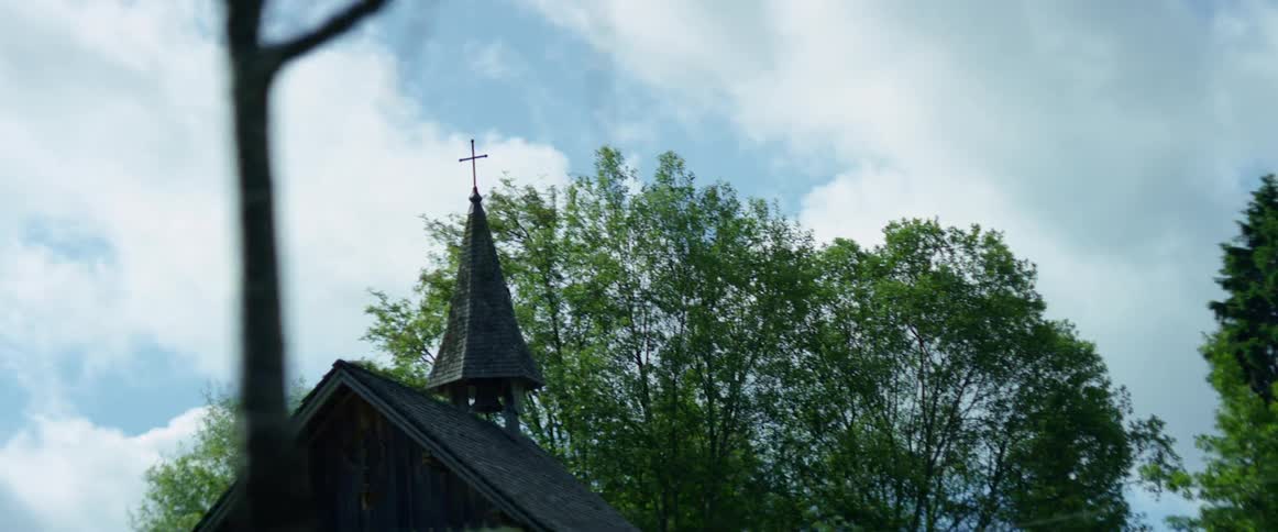 A small rural church on a cloudy summer day