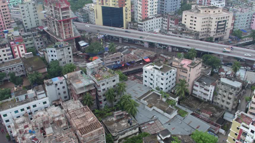 An aerial view of a downtown city is displayed