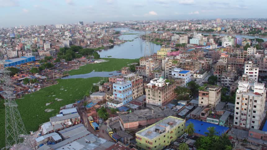 Aerial view of a river through a city at day