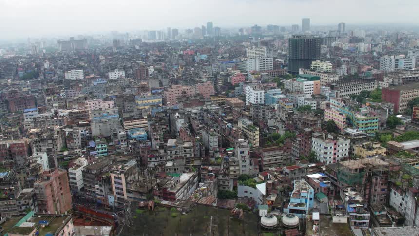 A city with buildings trees and streets with the sky in the background