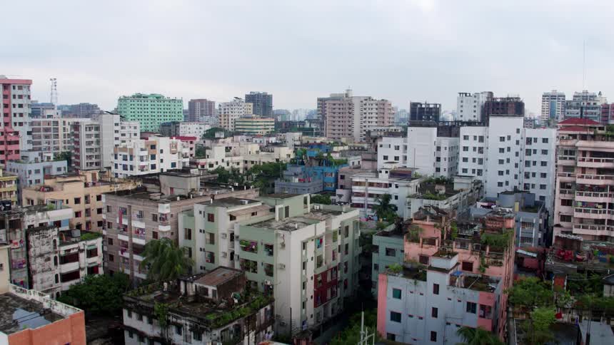 A crowded city on the banks of a river