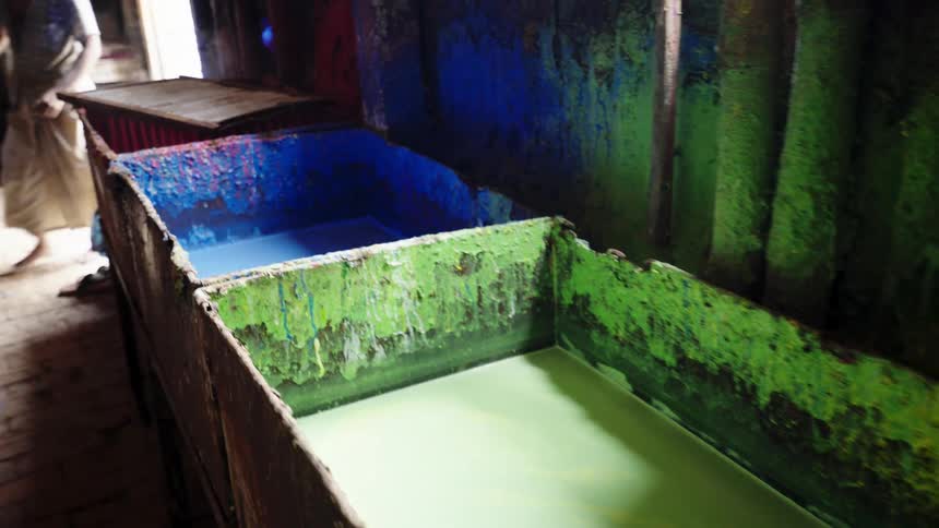 Colorful vats of hot dye on a third world country balloon factory
