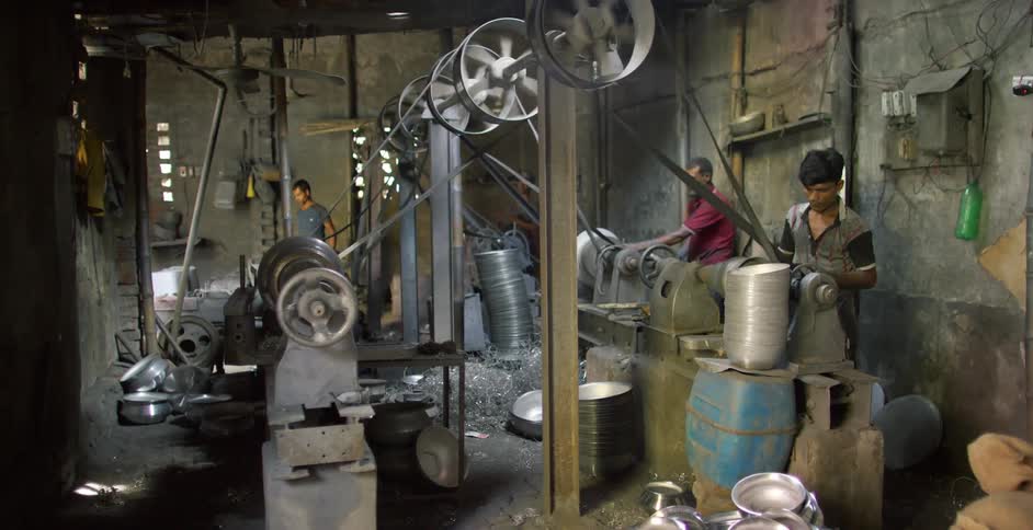 People working on a metal workshop in a third world country