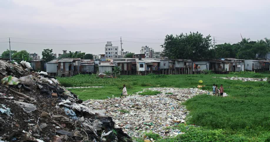 Children in dump sorting through garbage outside of neighborhood