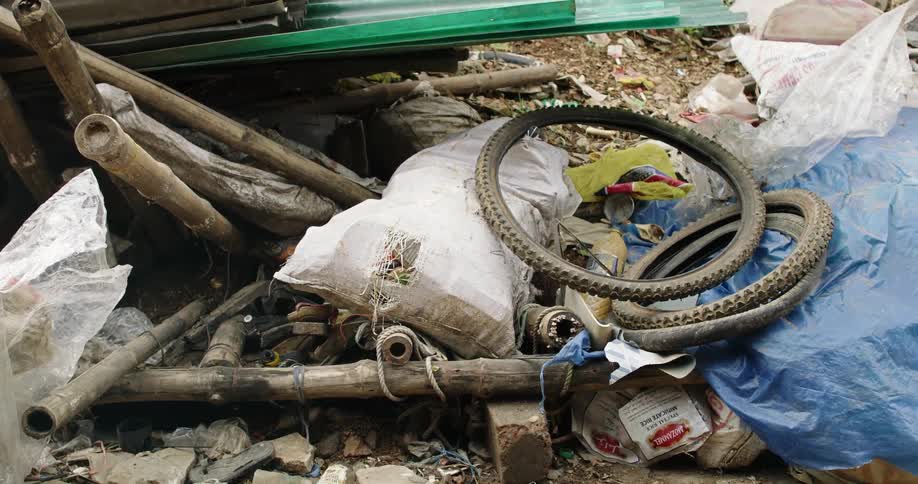 Pile of garbage laying on ground