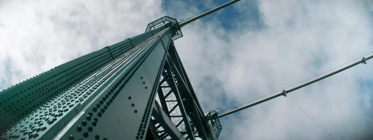 A tall metal structure on a cloudy day