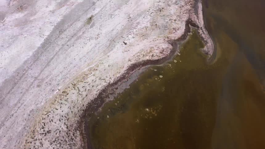 An aerial view of a planet and the coast against the land