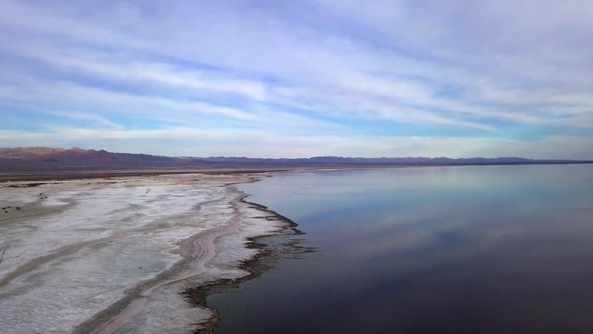 A barren coastline under a cloudy sky