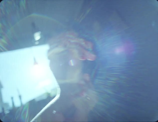 Female hands in glare from sun from window