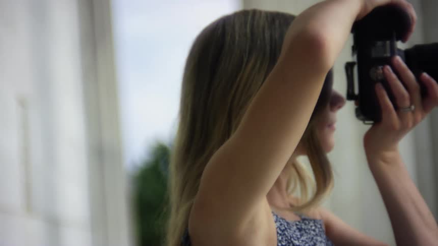 A teenage girl taking photos