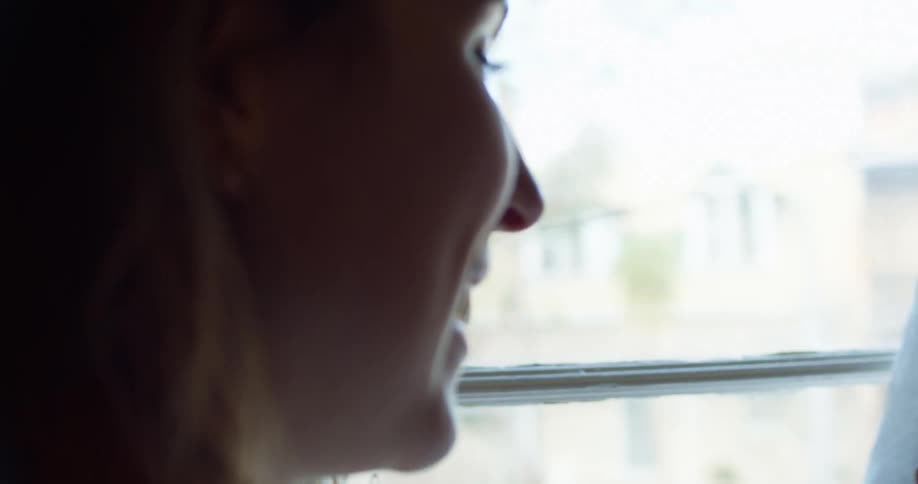 Side view of woman making a video call on the smartphone