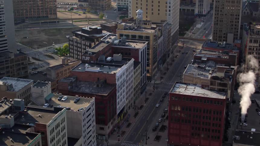 An aerial view of a downtown city is displayed
