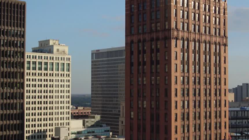 Within a metropolitan area in a city are numerous tall skyscrapers