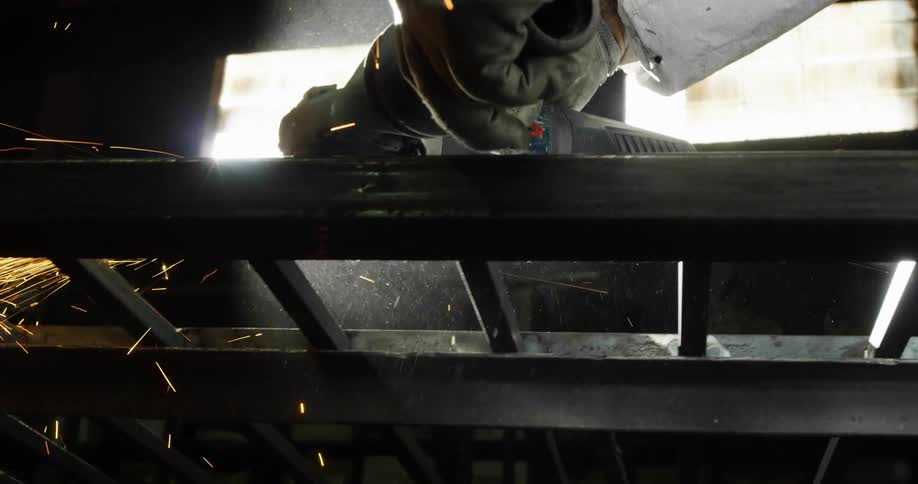Sparks flying around a power tool in a warehouse