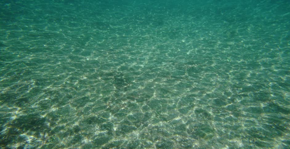 Underwater with the seafloor and lights