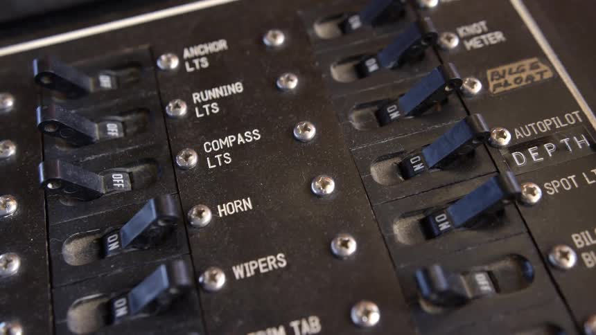 Electrical components for a large vehicle are controlled by a large switchboard