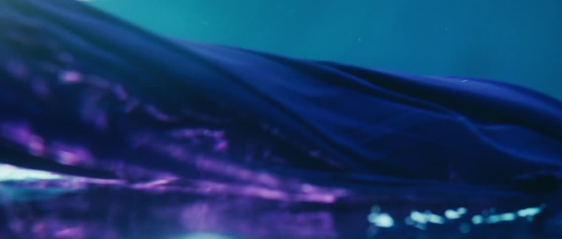 Purple fabric floating and billowing underwater