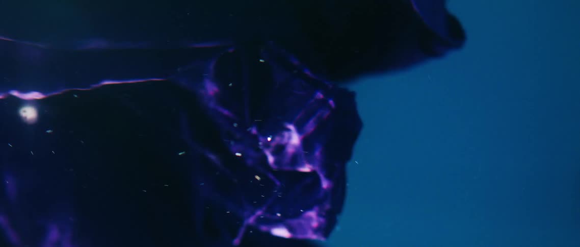 Purple cloth underwater with light and bubbles