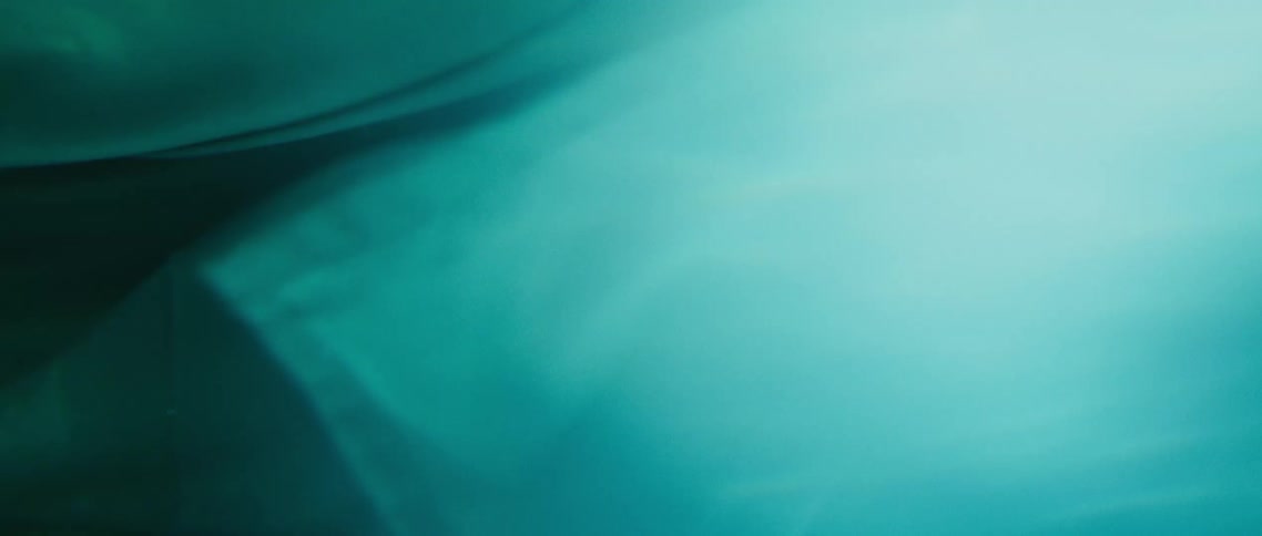 The sun is shining under the water