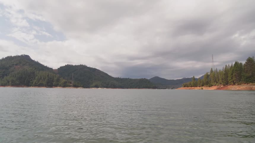 A river surrounded by mountains and trees