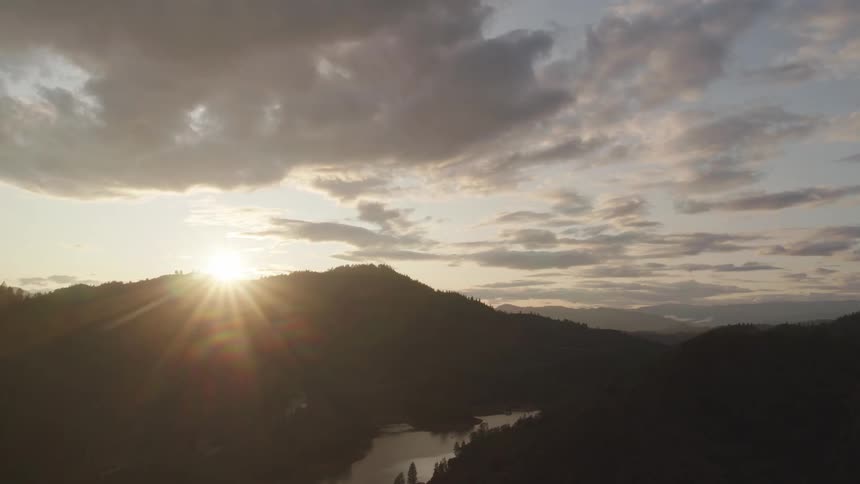 The sun is setting in the horizon