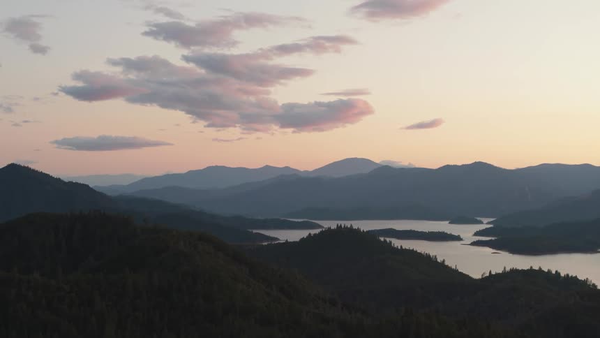 Mountains and large lake with islands at dawn