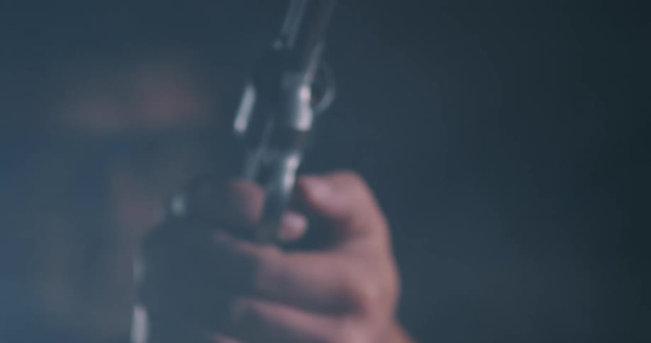 A person fires their gun