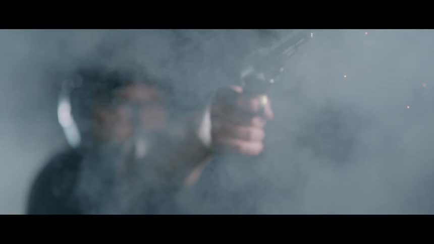 A white man fires a large revolver