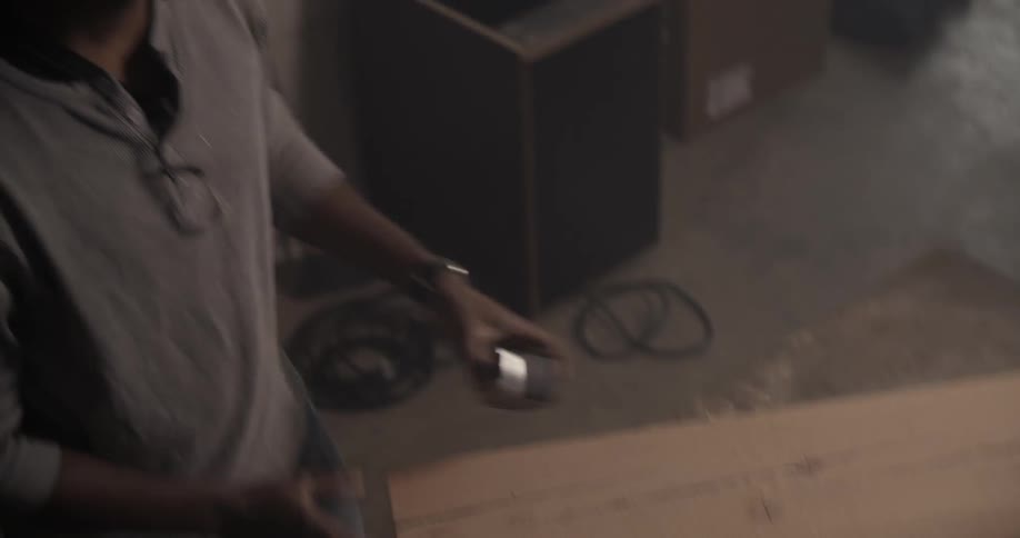 Man measuring the length of a board with his measuring tape
