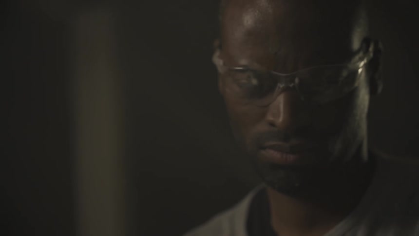 A man is looking down wearing goggles