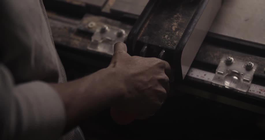 A man is using a workbench